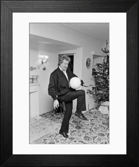 Framed Print : Denis Law, at home over Christmas in 1987. Denis Law CBE Framed Print : Denis Law, at home over Christmas in 1987. Denis Law CBE