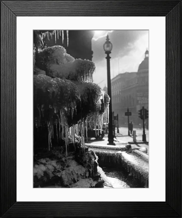 Framed Print : Picture shows the icicles which have formed on the Eros statue in Piccadilly Circus Framed Print : Picture shows the icicles which have formed on the Eros statue in Piccadilly Circus