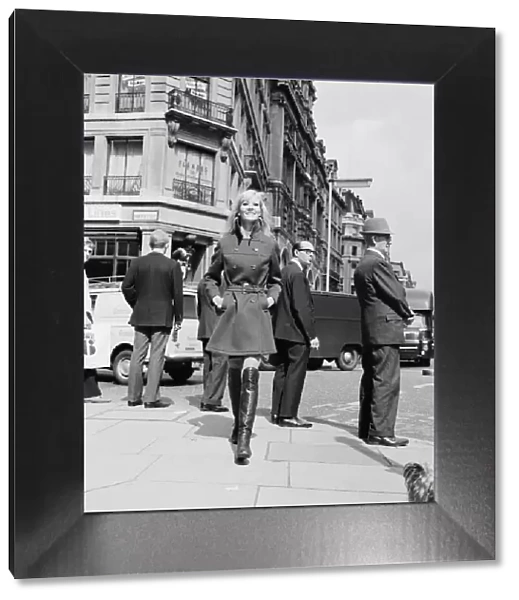 Vicki Hodge, model, photographed in Regent Street, in a long-short coat