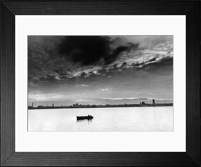 Framed Print : The Mersey Millpond. As night draws in, a lonely boat makes its way along a peaceful Framed Print : The Mersey Millpond. As night draws in, a lonely boat makes its way along a peaceful