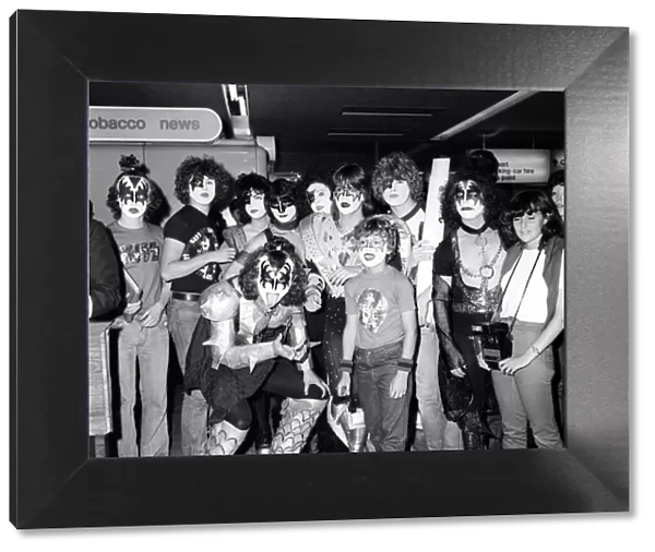The Pop Group Kiss pose with their fans in full make at Heathrow Airport. September 1980