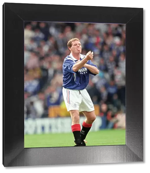 Glasgow Rangers footballer Paul Gascoigne making a one finger gesture while sticking out