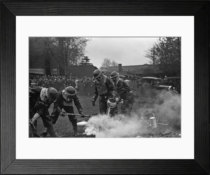 Framed Print : Members of the ARP demonstrate how to deal with a suspected gas attack during a series of