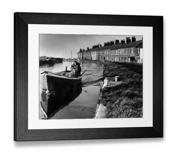 Framed Print : A girl and her dog on a peaceful boat trip on the Leeds and Liverpool canal near Ormskirk