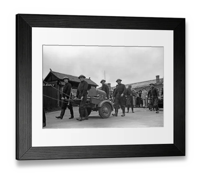 Framed Print : Members of the Esher Auxiliary Fire Service parade with their Coventry Climax pump at a