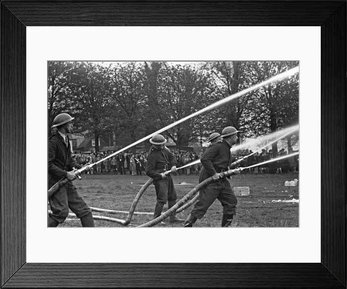 Framed Print : Members of the Auxiliary Fire Service seen here during a demonstration of civil defence