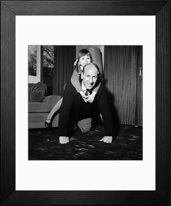 Framed Print : Bobby Charlton with his daughter Suzanne, after finding out that the Queen has named one Framed Print : Bobby Charlton with his daughter Suzanne, after finding out that the Queen has named one