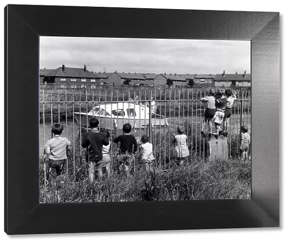 Children looking at the Leeds and Liverpool Canal. July 1968
