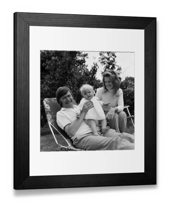 Framed Print : Mike Yarwood relaxing at home with his wife Sandra and their 10-month-old daughter