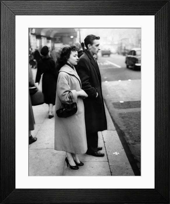 Framed Print : A young couple stand on the site of the altar of St Peters Church Framed Print : A young couple stand on the site of the altar of St Peters Church
