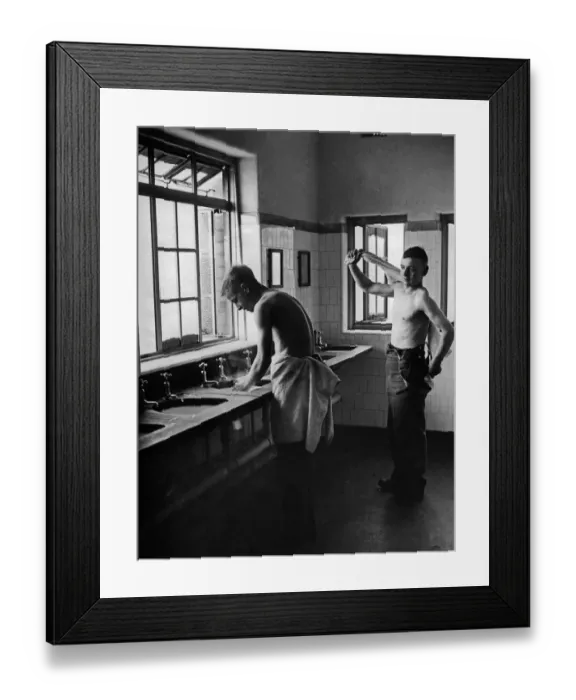Framed Print : Two new recruits getting use to army life making an early morning toilet in one of the up Framed Print : Two new recruits getting use to army life making an early morning toilet in one of the up