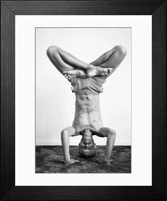 Framed Print : Yoga positions. Position is called Lotus in Tripod Headstand