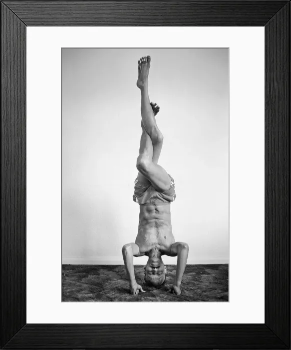 Framed Print : Yoga positions. Position is called Eagle in Tripod Headstand
