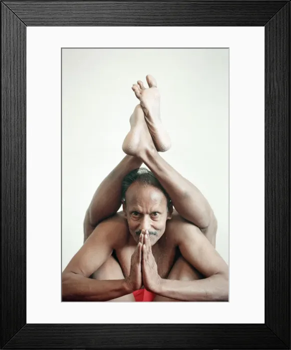 Framed Print : Yoga positions. Position is called Two Legs behind Head Pose Framed Print : Yoga positions. Position is called Two Legs behind Head Pose