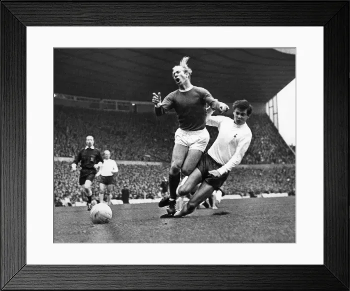 Framed Print : Bobby Charlton is tacked by Cyril Knowles during the Manchester United verses Tottenham Framed Print : Bobby Charlton is tacked by Cyril Knowles during the Manchester United verses Tottenham