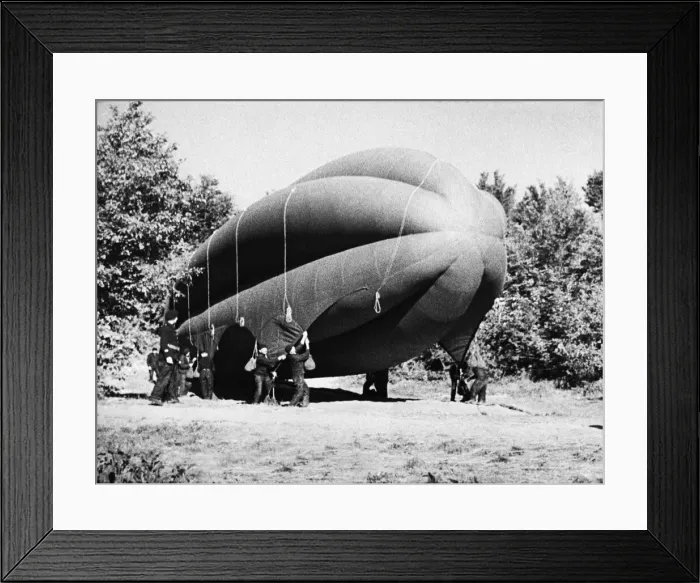 Framed Print : An observation balloon is a type of balloon that is employed as an aerial platform for Framed Print : An observation balloon is a type of balloon that is employed as an aerial platform for