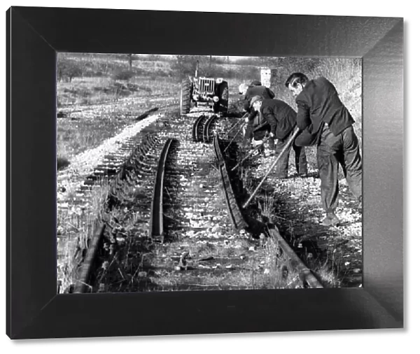 British Railways workmen lever a length of rail from its chairs on the old Nuneaton-Ashby