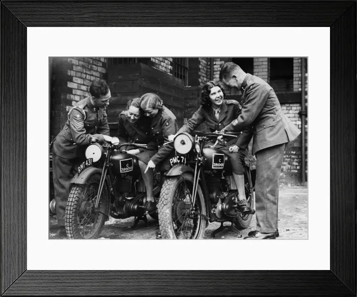 Framed Print : Members of the W. A. T.s learn a little about motorcycling from soldier at a Manchester