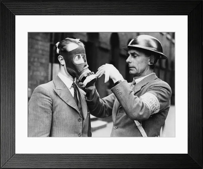 Framed Print : A warden fitting context masking tape to a civilian air respirator commonly known as a Framed Print : A warden fitting context masking tape to a civilian air respirator commonly known as a