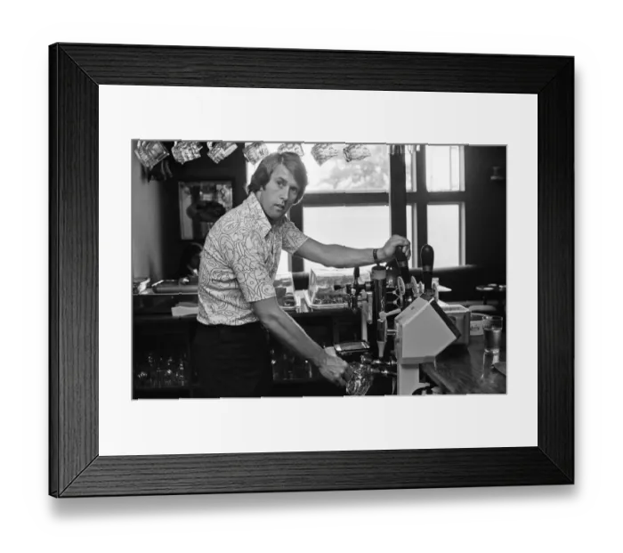 Framed Print : Geoff Hurst, Stoke City and ex-England footballer, pictured working in the pub that he Framed Print : Geoff Hurst, Stoke City and ex-England footballer, pictured working in the pub that he