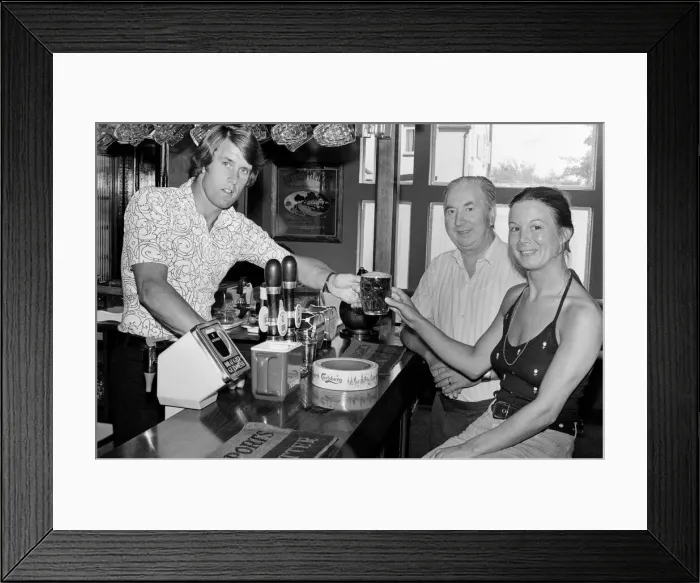 Framed Print : Geoff Hurst, Stoke City and ex-England footballer, pictured working in the pub that he