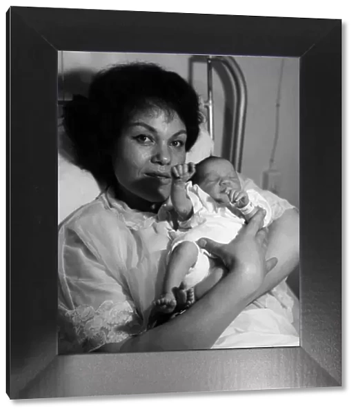 Jazz singer Cleo Laine pictured with her new baby daughter Jaqueline. 6th February 1963
