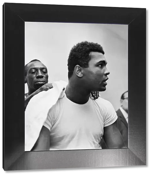 Muhammad Ali, In training with trainer wiping him down. Ali