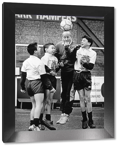 Bobby Charlton pictured training with school boys from Bebington High School