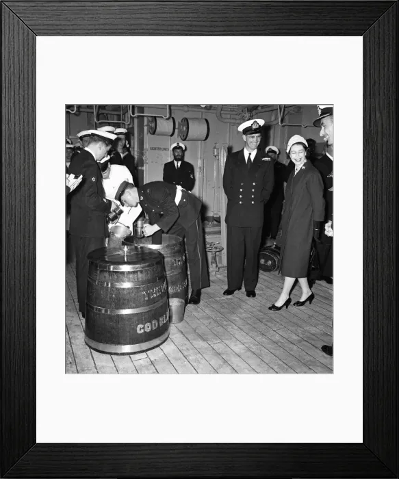 Framed Print : Queen Elizabeth II watches Victualling Officer B. R. Hailstone issuing the rum ration Framed Print : Queen Elizabeth II watches Victualling Officer B. R. Hailstone issuing the rum ration