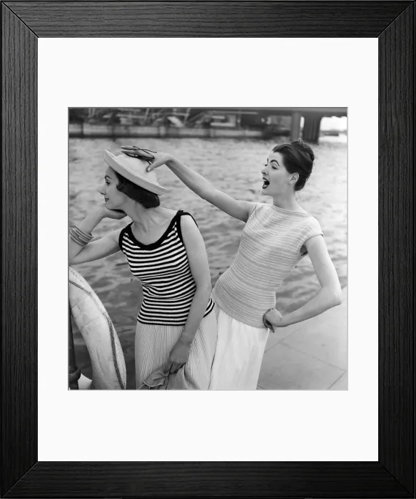 Framed Print : Models by a river, one is wearing a striped cotton sweater. 14th June 1957 Framed Print : Models by a river, one is wearing a striped cotton sweater. 14th June 1957