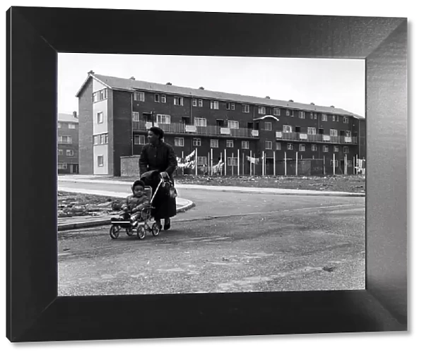 A woman and child walking in Butetown, Cardiff. 5th May 1961