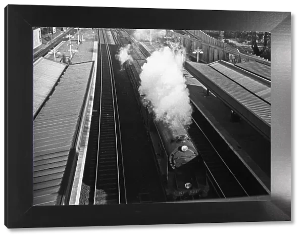 Express train thunders through Surbiton station. November 1938
