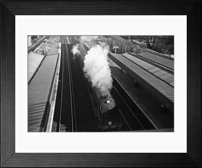 Framed Print : Express train thunders through Surbiton station. November 1938 Framed Print : Express train thunders through Surbiton station. November 1938