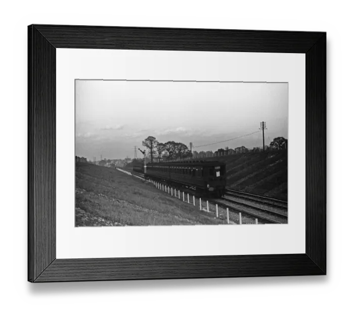 Framed Print : A three carriage Electric Multiple Unit train seen here on the Chessington branch line Framed Print : A three carriage Electric Multiple Unit train seen here on the Chessington branch line