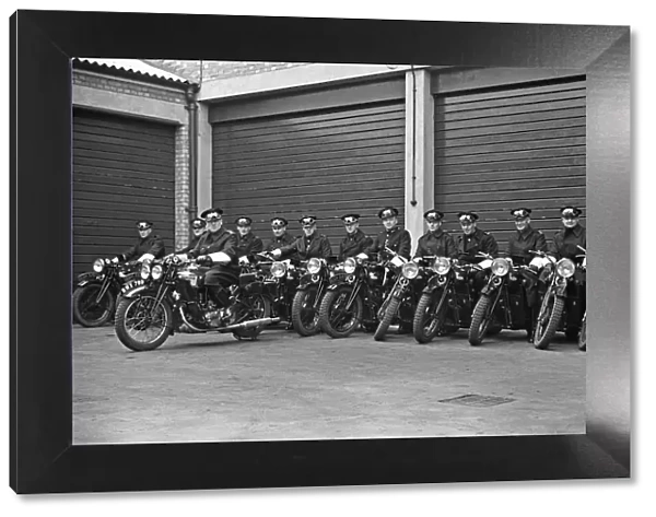 A group of police motorcyclists receive a final briefing at Hampton Police Station