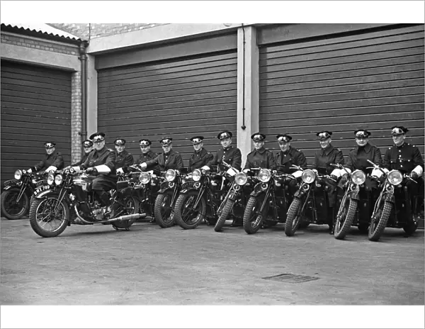 A group of police motorcyclists receive a final briefing at Hampton Police Station