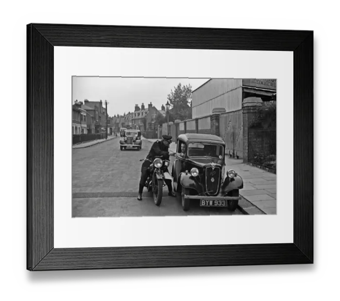 Framed Print : A police motorcyclists issues a warning to a motorist in Hampton, Middlesex Framed Print : A police motorcyclists issues a warning to a motorist in Hampton, Middlesex