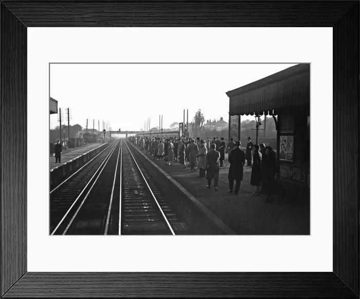 Framed Print : Commuters await the next train to Waterloo. November 1938