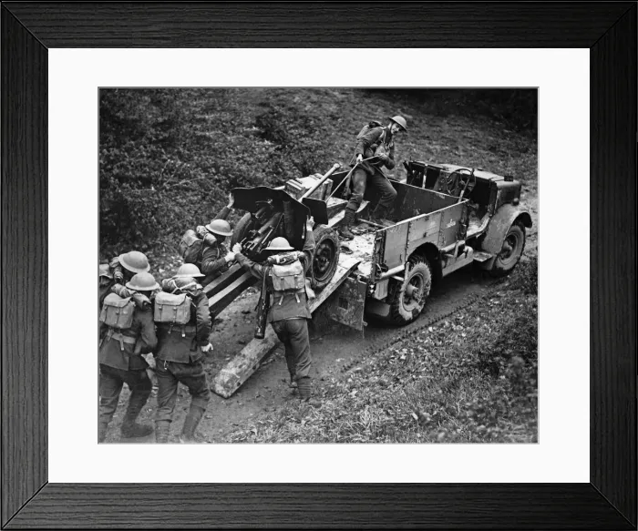 Framed Print : Anti tank gun being unloaded from a transport truck at the double to ready for action