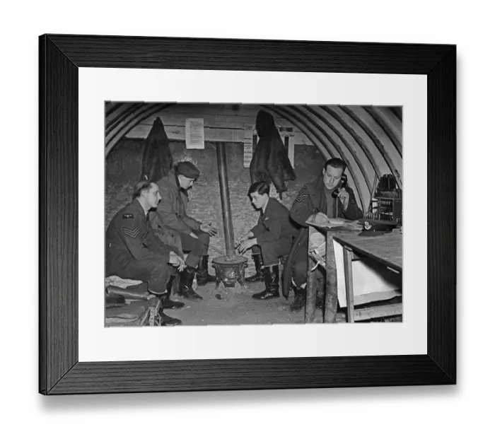 Framed Print : Fighter pilots of 73 Squadron RAF warm their hands on a brazier in their underground Duty Framed Print : Fighter pilots of 73 Squadron RAF warm their hands on a brazier in their underground Duty