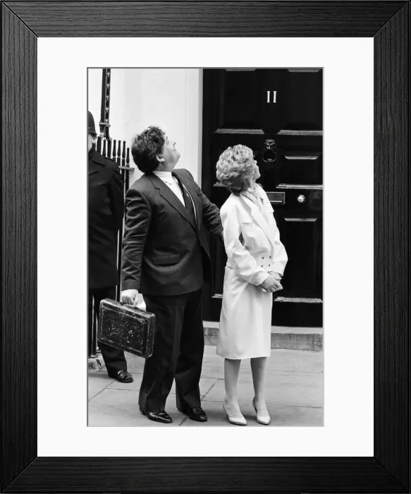 Framed Print : Chancellor of the Exchequer Nigel Lawson and his wife Therese look up at their children
