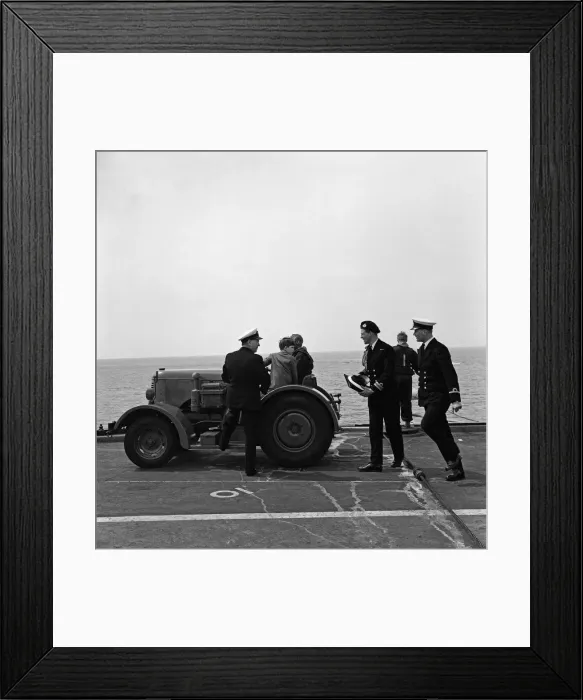 Framed Print : The Prince of Wales is taken for a trip round the flight deck of HMS Eagle in a tractor
