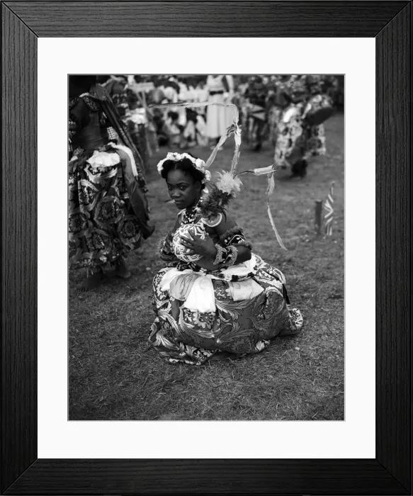 Framed Print : A Nigerian dancer from the Efik tribe stops at the end of a traditional dance for Framed Print : A Nigerian dancer from the Efik tribe stops at the end of a traditional dance for