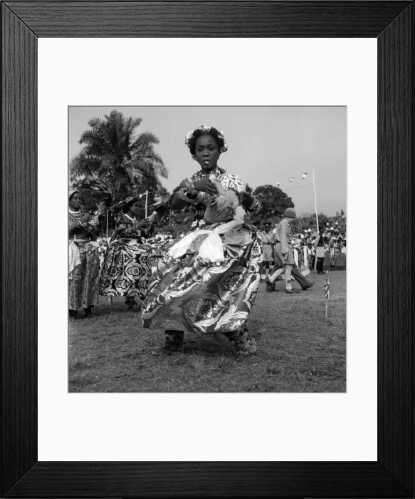 Framed Print : A Nigerian dancer from the Efik tribe stops at the end of a traditional dance for Framed Print : A Nigerian dancer from the Efik tribe stops at the end of a traditional dance for