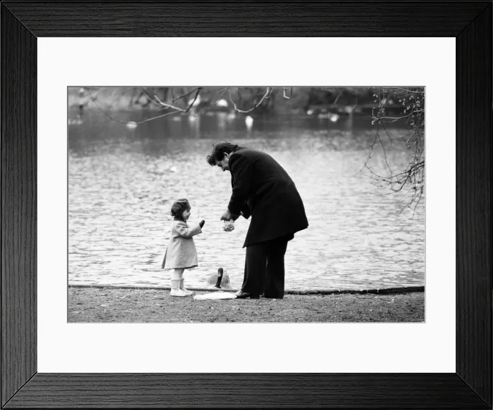 Framed Print : Chancellor of the Exchequer Nigel Lawson enjoys a pre-Budget walk with his family in St