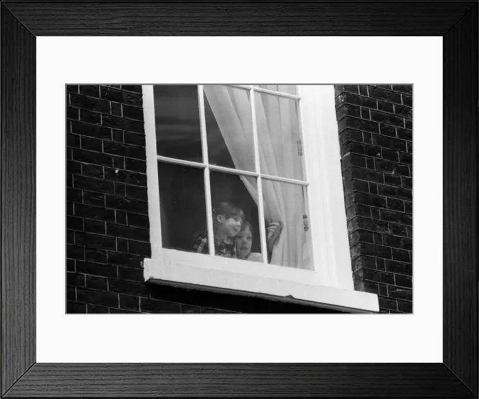 Framed Print : The children of Chancellor of the Exchequer Nigel Lawson watching from a window of 11