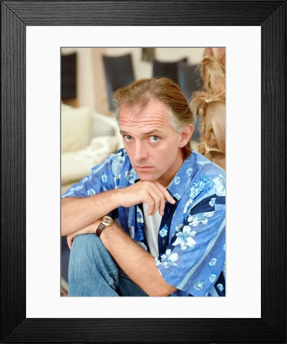Framed Print : Actor and comedian, Rik Mayall, pictured at home four months after his horrific quad bike