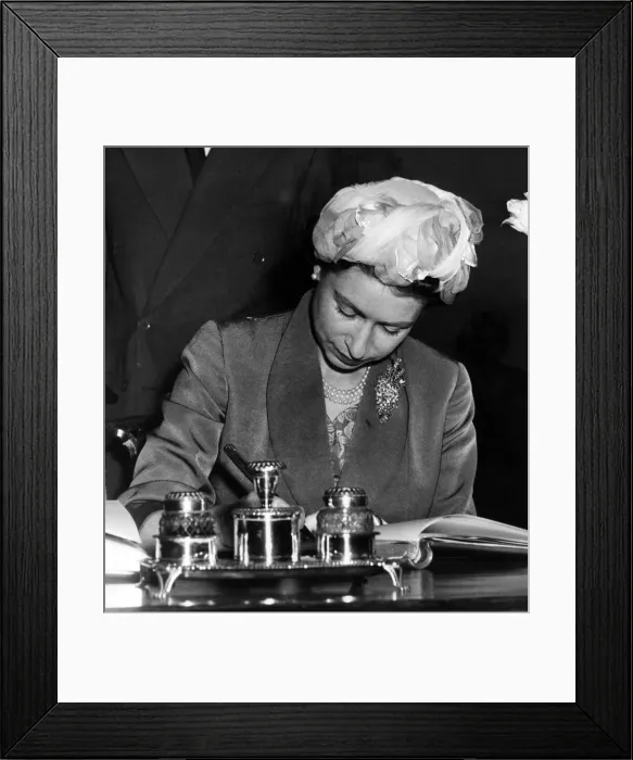 Framed Print : Queen Elizabeth II signs the visitors book at Stratford Town Hall during her visit Framed Print : Queen Elizabeth II signs the visitors book at Stratford Town Hall during her visit