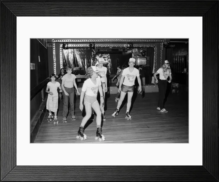 Framed Print : Young holidaymakers at the roller disco at the James Corrigan seafront amusement arcade