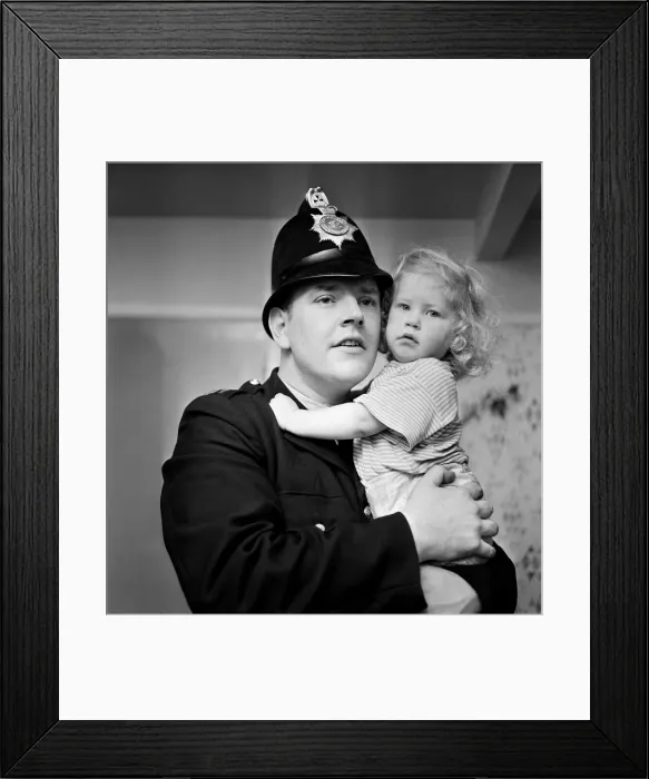 Framed Print : Two-year-old Deborah Almond, and PC Brian Corner, who rescued the toddler from a river